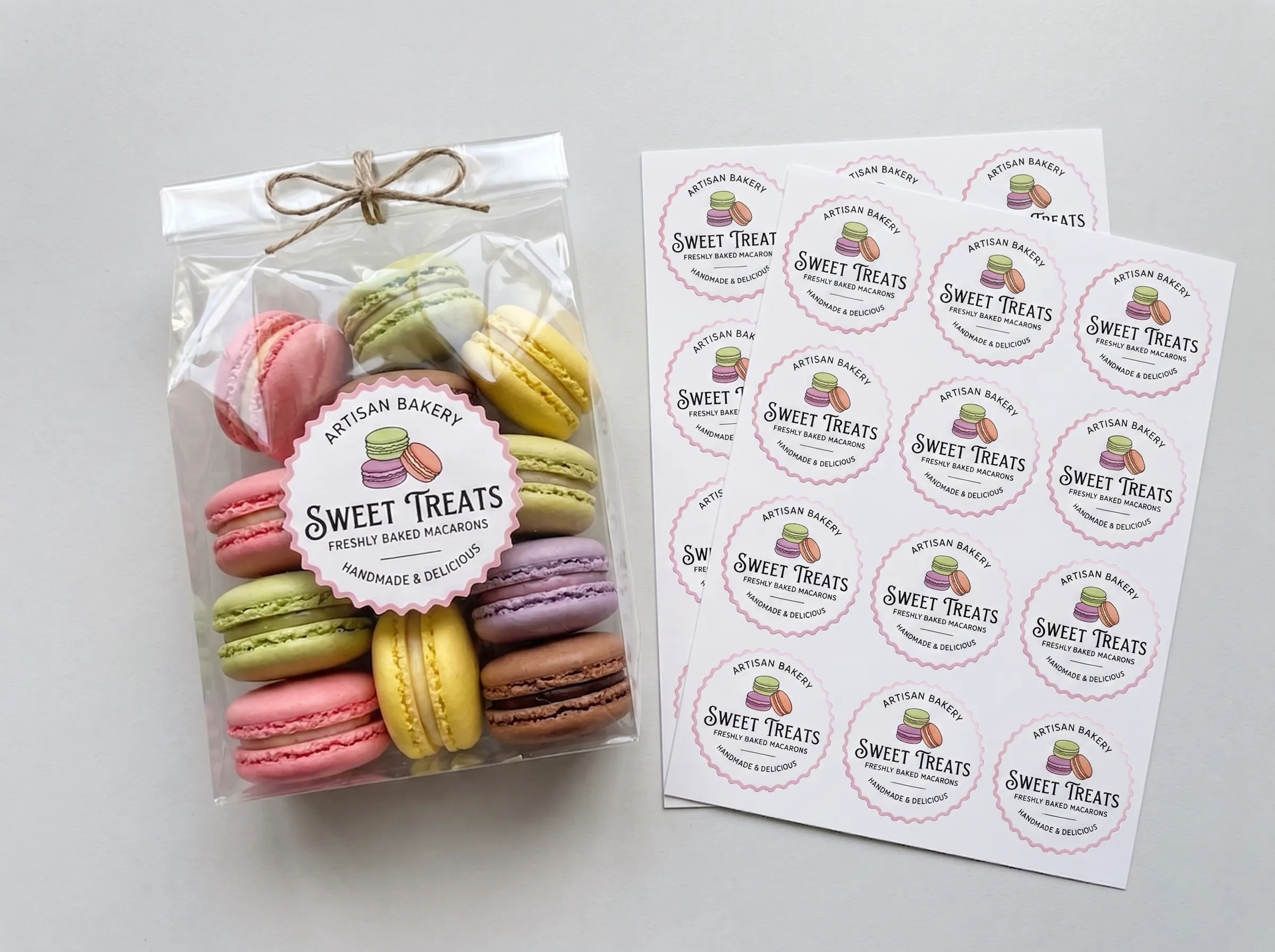A clear bag of colorful macarons sealed with a custom round sticker, displayed next to two matching printed sticker sheets.